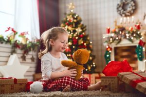 child opening Christmas present