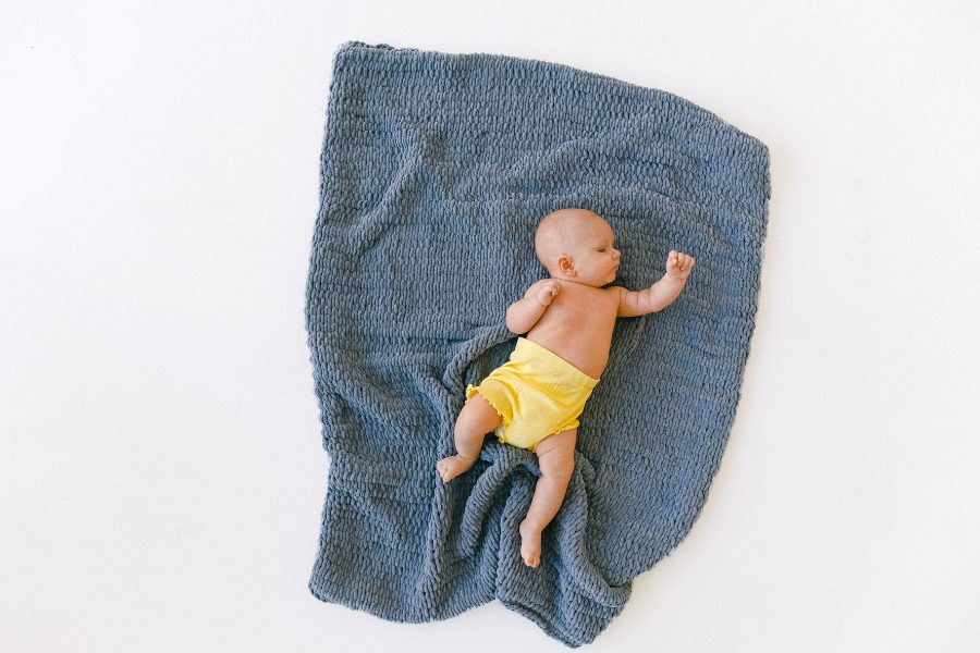 Sleeping baby on blanket