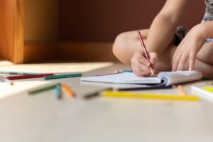 Child writting on floor