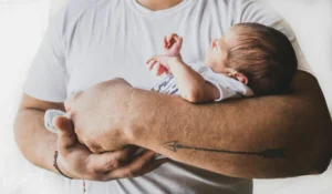 Man Holding a Baby