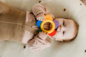 Baby chewing on teething ring