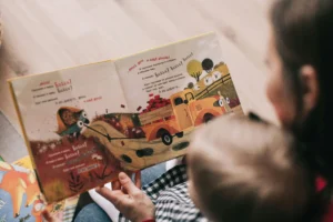 Mother and child reading a book together