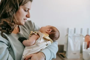 Mother cradling baby in her arms