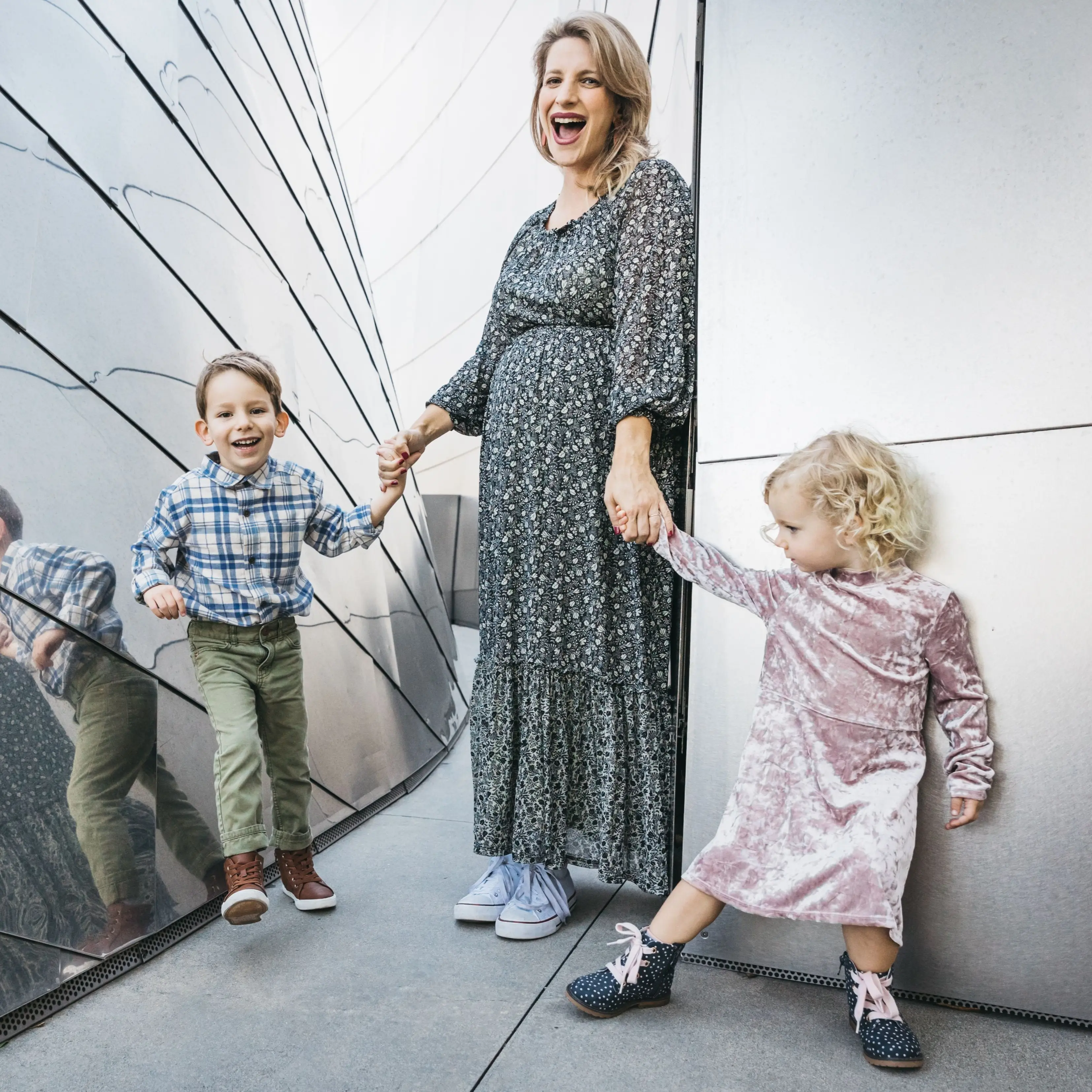 Allison Cantor holding her children's hands