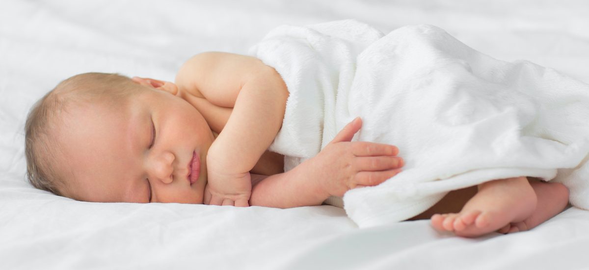 Newborn baby sleeping on a blanket. Age 1 week Newborn baby sleeping on a blanket. Age 1 week